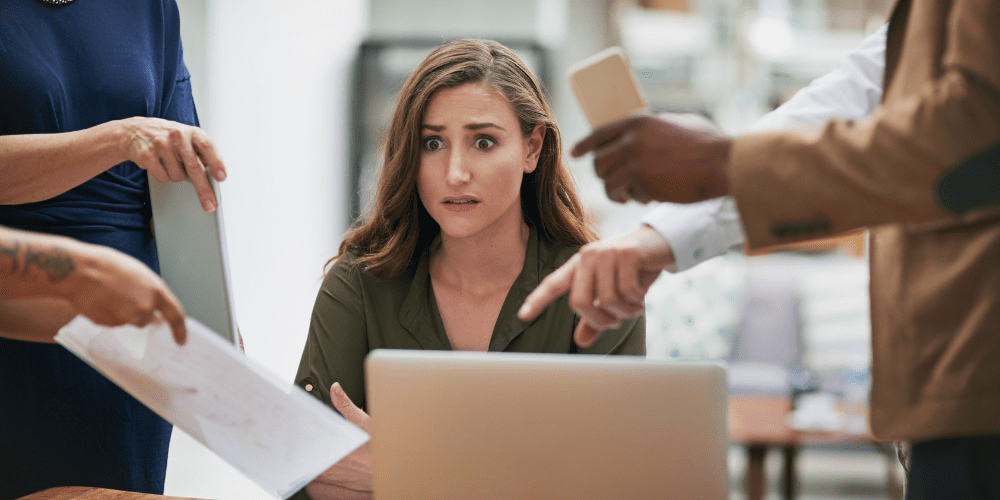 young woman at work with anxiety not taking care of her mental health